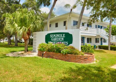 Seminole Gardens Apartments entrance sign and courtyard