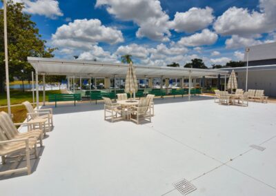 Covered outdoor lounge seating area at Seminole Gardens